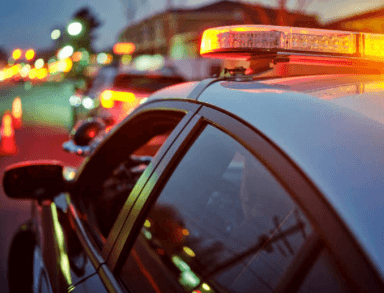 the image shows police lights and there is an accident