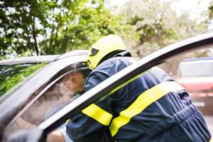 man sitting in car after a car accident injuries