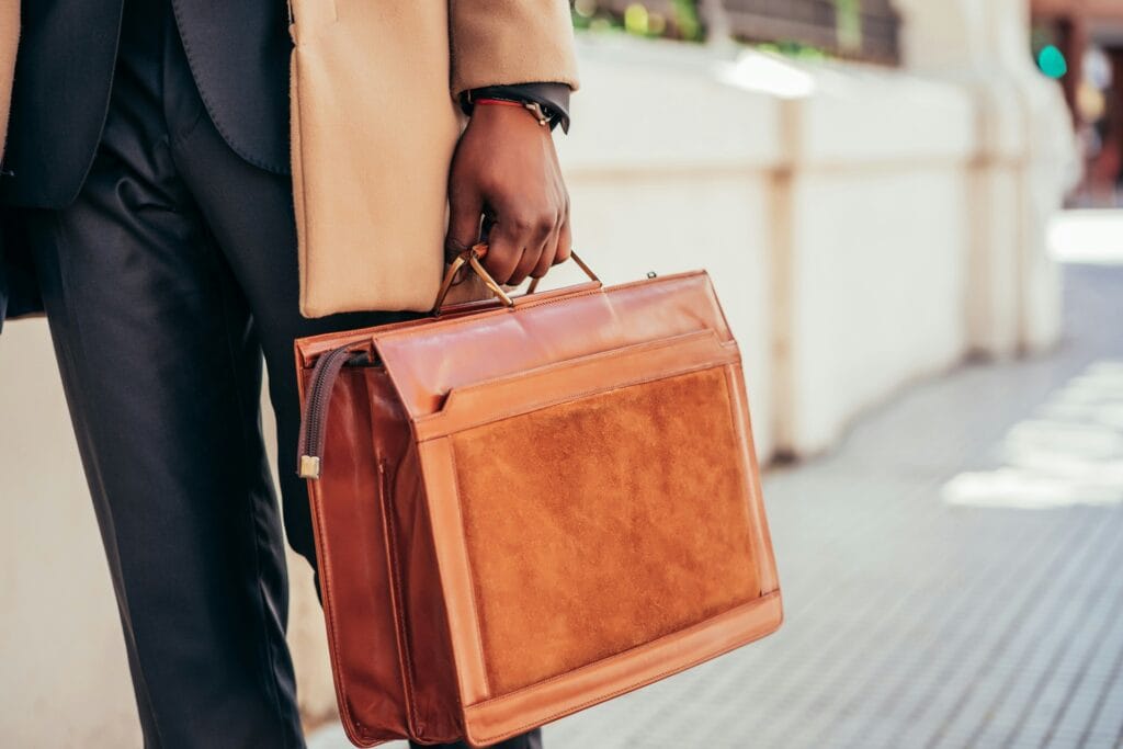 lawyer holding a briefcase - what can a lawyer do for you after a car accident
